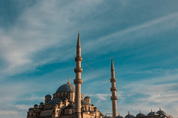Fototapeta na wymiar Mosques of Istanbul. Eminonu New Mosque or Yeni Cami at sunset