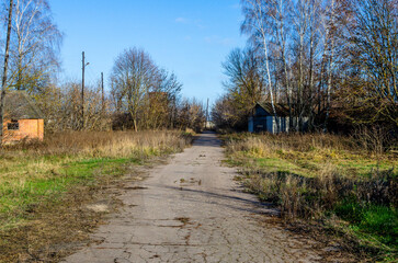 Road to an abandoned farm. The decline of agriculture.