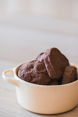 Close-up of a bowl with healthy cocoa cookies
