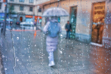 people with an umbrella in rainy days in Bilbao city, Basque country, Spain