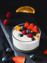 Yogurt dessert with chia, berries and orange. Healthy dessert.