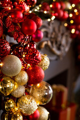 Close up of balls on Christmas tree. Bokeh garlands in the background. New Year and Christmas concept.