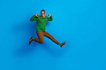 Fototapeta na wymiar Full length photo of funny successful businessman working his own company jumping fingers point himself best promo isolated on blue color background