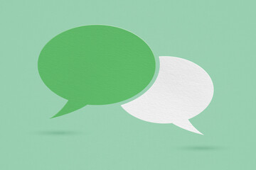 green and white speech bubble grunge paper cut on grunge background. Conceptual image about communication and social media, customer feedback