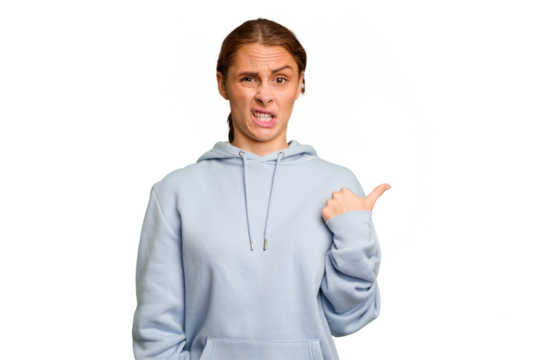 Young caucasian woman isolated shocked pointing with index fingers to a copy space.