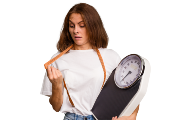 Young nutritionist caucasian woman holding scale and mesure tape isolated