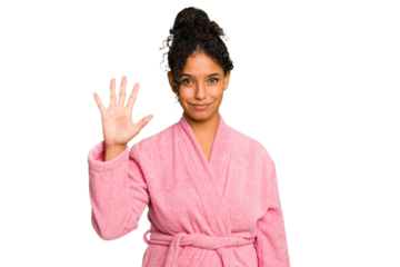 Young brazilian woman wearing a pink bathrobe isolated smiling cheerful showing number five with fingers.