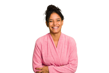 Young brazilian woman wearing a pink bathrobe isolated laughing and having fun.