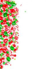 Christmas background of colorful candies. Red and green candies of different shapes on a white background, close-up. copy space.