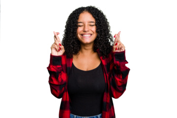Young cute brazilian woman isolated crossing fingers for having luck