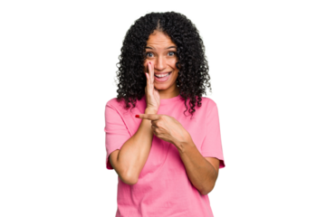 Young cute brazilian woman isolated saying a gossip, pointing to side reporting something.
