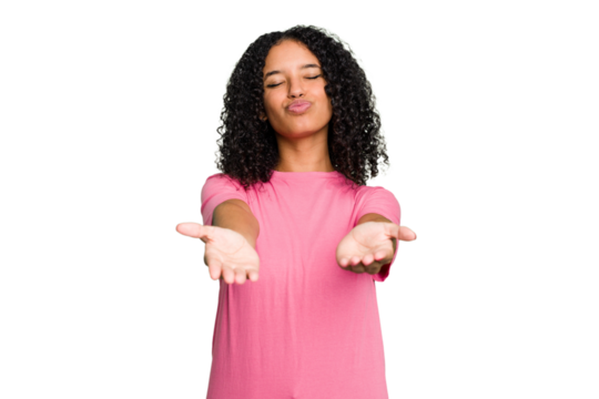 Young cute brazilian woman isolated folding lips and holding palms to send air kiss.