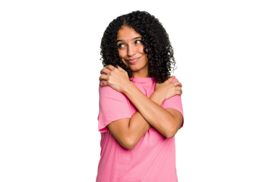 Young cute brazilian woman isolated hugs, smiling carefree and happy.