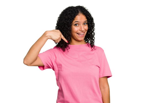 Young cute brazilian woman isolated person pointing by hand to a shirt copy space, proud and confident