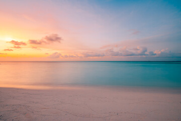Fototapeta premium Closeup sea sand beach. Beautiful beach landscape. Inspire tropical beach seascape horizon. Dreamy sunset sky calm tranquil relax sunset summer mood. Positive energy, meditation summer tropical island