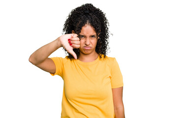 Fototapeta na wymiar Young cute brazilian woman isolated showing thumb down and expressing dislike.