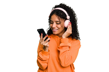 Young brazilian woman listening to music with headphones isolated