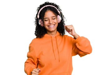 Young brazilian woman listening to music with headphones isolated