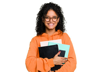 Young African american student woman holding a lot of books isolated