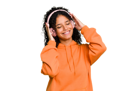 Young brazilian woman listening to music with headphones isolated - Powered by Adobe
