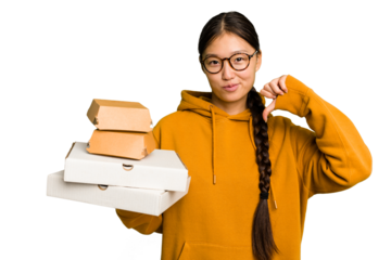 Young student asian woman holding a takeaway food isolated feels proud and self confident, example to follow.