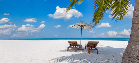 Beautiful tropical beach banner. Couple chairs scene, white sand coco palms travel panorama. Sunny...