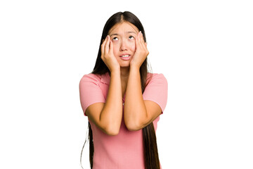 Young Asian woman isolated whining and crying disconsolately.
