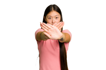 Young Asian woman isolated doing a denial gesture