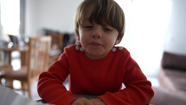 Mischievous Little Boy Spitting To Camera. Naughty Child Not Behaving And Laughing Smiling