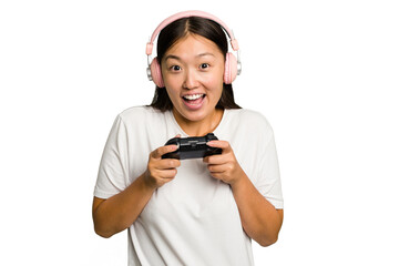 Young asian gamer woman playing with a game controller and headphones isolated - obrazy, fototapety, plakaty