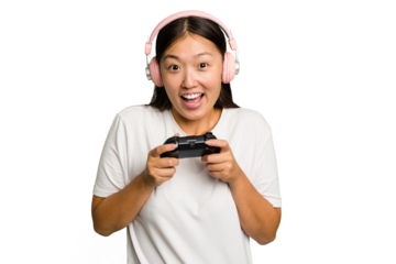 Young asian gamer woman playing with a game controller and headphones isolated