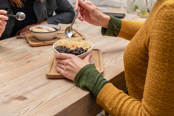 Two friends having some acai smoothie bowls