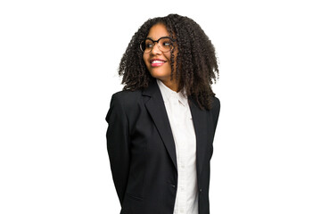 Young african american business woman isolated looks aside smiling, cheerful and pleasant.