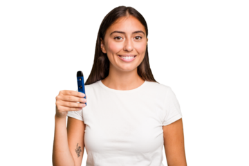 Young caucasian woman holding a electronic cigarette happy, smiling and cheerful.