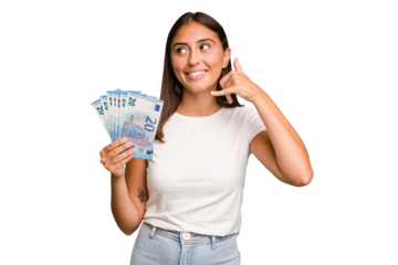 Young caucasian woman holding a banknotes isolated showing a mobile phone call gesture with fingers.