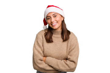 Young caucasian woman celebrating christmas wearing a santa hat isolated laughing and having fun.