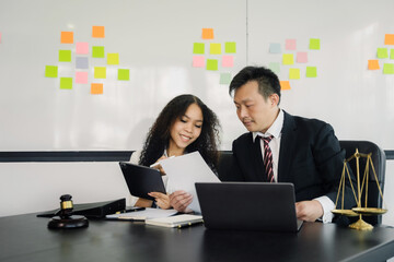 Business people and lawyers discussing contract papers sitting in the table at office in the morning. concepts of law, advice, legal services.