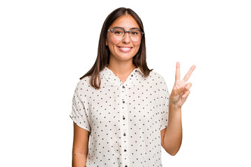 Young cute caucasian woman isolated joyful and carefree showing a peace symbol with fingers.