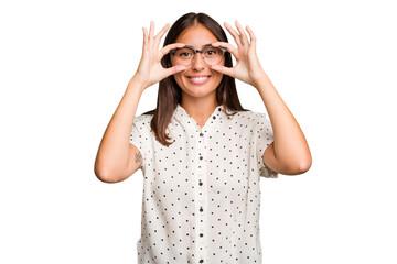 Young cute caucasian woman isolated showing okay sign over eyes