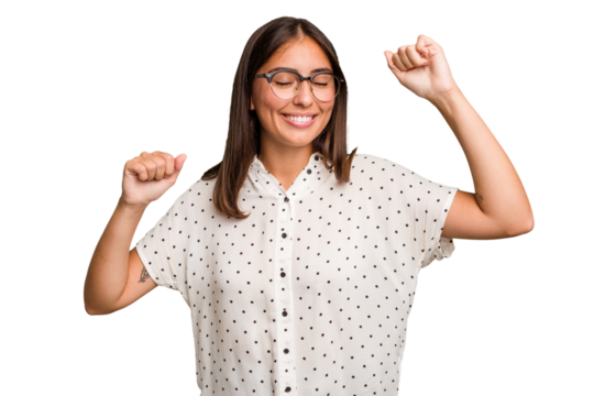 Young cute caucasian woman isolated celebrating a special day, jumps and raise arms with energy.