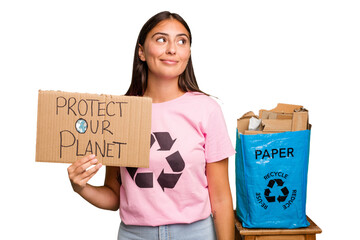Young caucasian recycler woman holding a protect our planet placard isolated