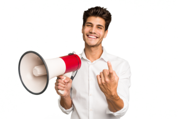 Young caucasian man holding megaphone isolated pointing with finger at you as if inviting come closer.