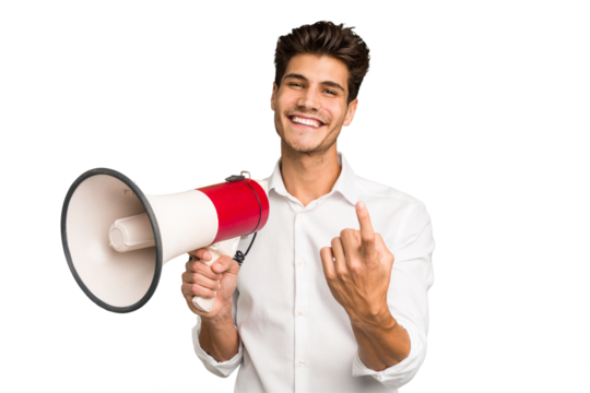 Young caucasian man holding megaphone isolated pointing with finger at you as if inviting come closer.