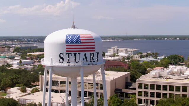 Rapid orbiting shot of water tower in city Stuart in Florida