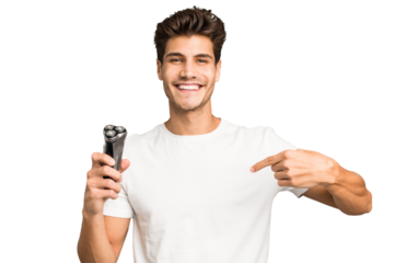 Young caucasian man holding a razor isolated person pointing by hand to a shirt copy space, proud and confident