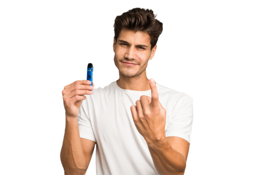 Young caucasian man holding an electronic cigarette isolated pointing with finger at you as if inviting come closer.