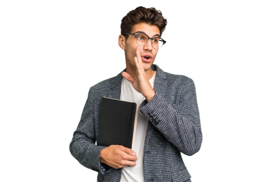 Young teacher caucasian man holding a book isolated is saying a secret hot braking news and looking aside
