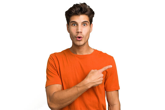 Young caucasian handsome man isolated pointing to the side