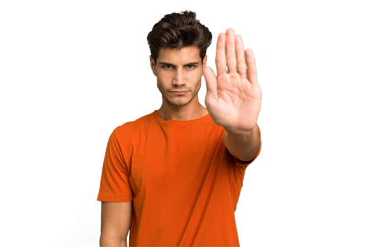 Young caucasian handsome man isolated standing with outstretched hand showing stop sign, preventing you.