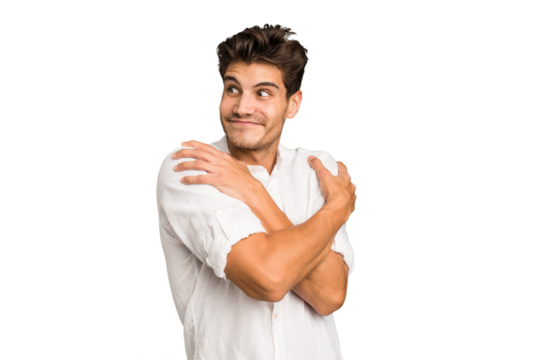 Young caucasian handsome man isolated hugs, smiling carefree and happy.